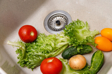 Washing vegetables in the sink