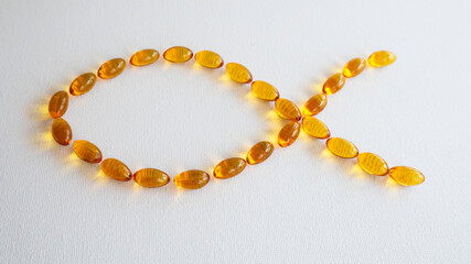 Omega3 capsules on white background.