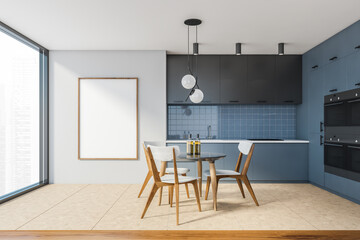 Modern white and blue kitchen with dining table and poster