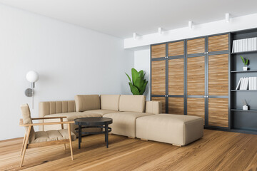 Stylish white and wooden living room corner with beige armchair and sofa