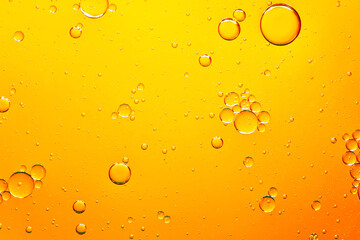oil with bubbles on coral background. Orange Abstract space background. Soft selective focus. macro of oil drops on water surface. copy space. air bubbles in water