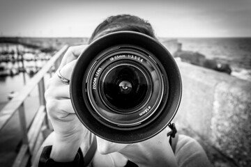 A lens of a reflex camera. - obrazy, fototapety, plakaty