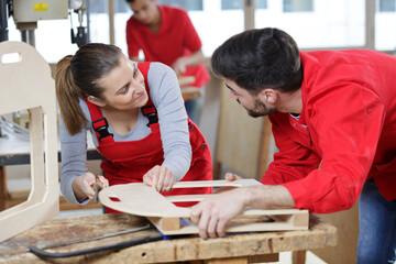 female and male workers in a workshop