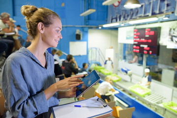 fish factory expert with touchpad