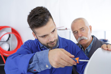 Obraz premium male machinist working on machine part