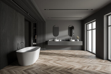 Tub and sink in stylish gray and wooden bathroom