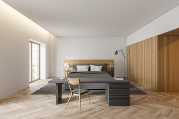 White and wooden bedroom interior with home office