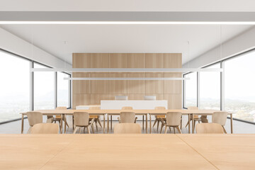 Fototapeta premium Table in modern white and wooden cafe interior