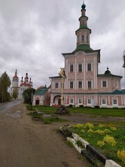 Fototapeta na wymiar An old pink church in a small town in rainy weather,Russia,Totma