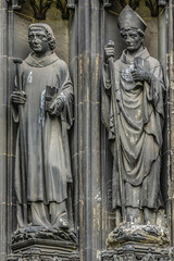Obraz premium Saints Statues at central portal of western facade of Saint-Ouen-de-Rouen. Rouen Saint-Ouen Abbey Church (Abbatiale Saint-Ouen, 1318 - 1537) - Gothic Roman Catholic church in Rouen, Normandy, France.