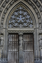 Saints Statues at central portal of western facade of Saint-Ouen-de-Rouen. Rouen Saint-Ouen Abbey Church (Abbatiale Saint-Ouen, 1318 - 1537) - Gothic Roman Catholic church in Rouen, Normandy, France.