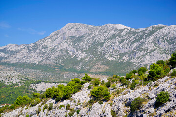 Dalmatian coastline mountains near Omis. Sunny day with blue sky