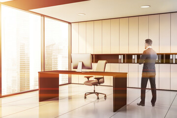 Man in white panoramic CEO office
