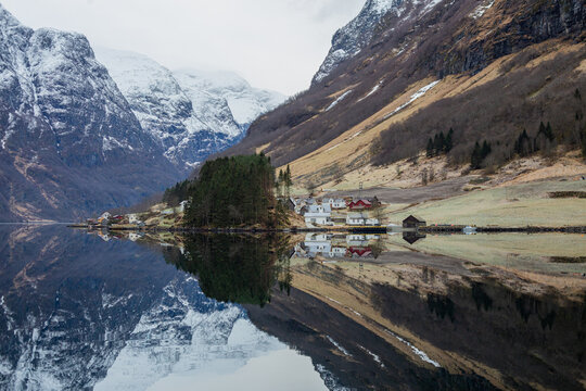 Norwegian fjord, village and mountains in winter. Mountain rural landscape view, Flam, Norway