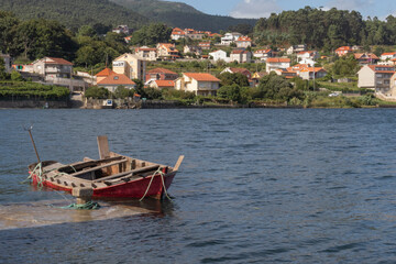 Fototapeta na wymiar the landscape of a village and a boat