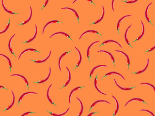 hot chili pattern. chili pepper isolated on orange background.