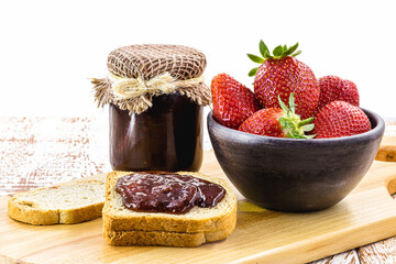 healthy breakfast, fresh strawberries and toast with handmade jam, isolated white background
