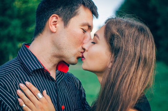 young attractive couple kissing each other