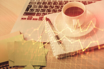 Fototapeta na wymiar Double exposure of forex chart drawing and desktop with coffee and items on table background. Concept of financial market trading
