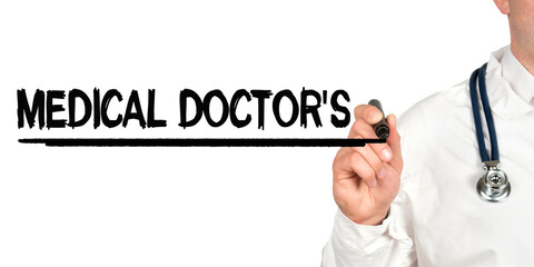 Doctor writes the word - MEDICAL DOCTORS. Image of a hand holding a marker isolated on a white background.