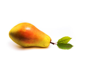 Red pear with leaves lies on a white isolated background