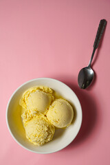 Scoops of vanilla bean ice cream in a bowl