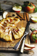 Selective focus. Galette with apples. Rustic style. Autumn pastries.