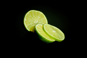 Sliced lime with dark background.