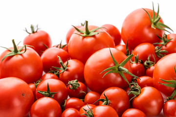 Tomatoes with sepals of different sizes on a white background