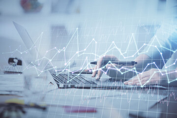 Multi exposure of woman hands typing on computer and financial chart hologram drawing. Stock market analysis concept.