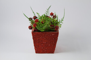 Red flowers in a red vase
