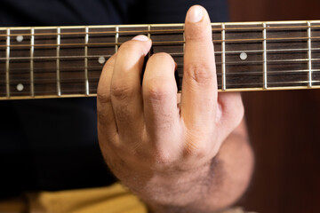 close up of a guitar player