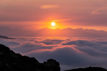 Sunrise view of valley fog and the San Gabriel Mountains from Rocky Peak Park in the Chatsworth neighborhood of Los Angeles, California.  