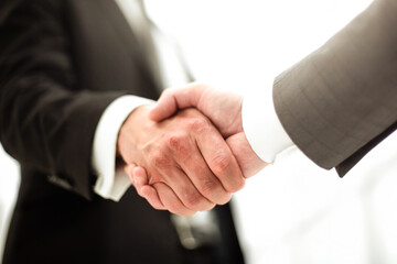 close up. reliable business partners shaking hands