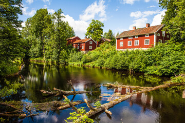 Fototapeta premium A red Swedish traditional house on the countryside in Sweden