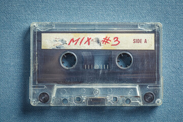 One old audio cassettes on blue sofa