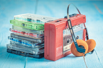 Vintage audio cassette with headphones and player