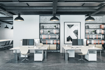 Modern coworking office interior with picture on wall.