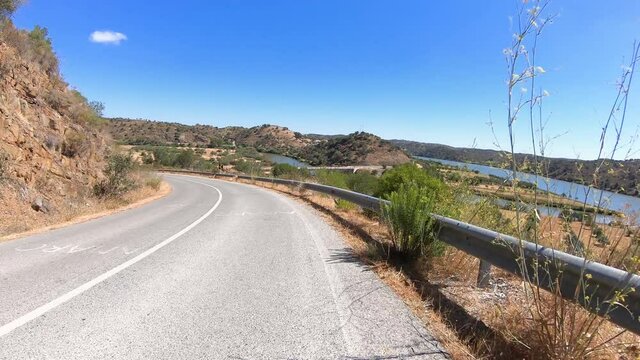 riding on the M1063 paved road next to Foz de Odeleite village, Castro Marim department, Algarve, Portugal