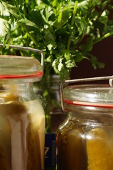 Old glass jars with pickled cucumbers