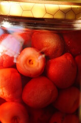 Red cherries in a jar, food supplies, survival mortar - obrazy, fototapety, plakaty