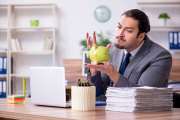 Young male employee working in the office