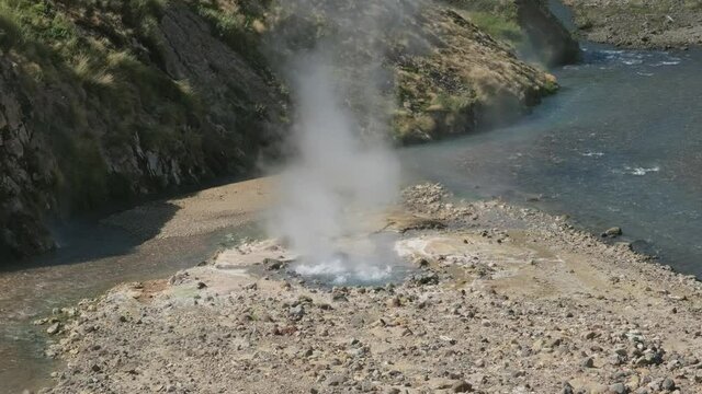 Hot springs and fumaroles in famous Valley of Geysers, Kamchatka peninsula, Russia, 4k