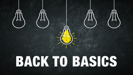 Phrase „back to basics“ on a rustic background with 5 light bulbs.