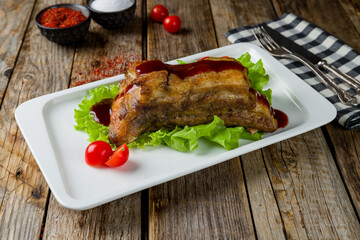 beef ribs on bone with bbq sause on old wooden table