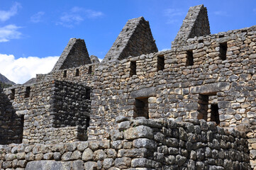 Fototapeta na wymiar A close up view of the stone buildings and ruins inside the ancient Incan city of Machu Picchu