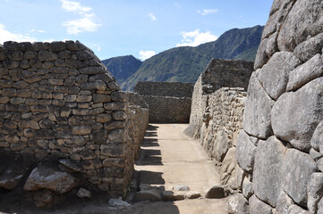 Fototapeta na wymiar A close up view of the stone buildings and ruins inside the ancient Incan city of Machu Picchu