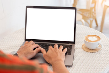 computer mockup blank screen.hand man work using laptop with white background for advertising,contact business search information on desk at coffee shop.marketing and creative design