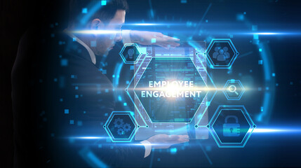 Business, Technology, Internet and network concept. Young businessman working on a virtual screen of the future and sees the inscription: Employee engagement