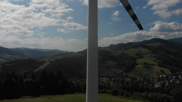 Take off in front of wind turbine